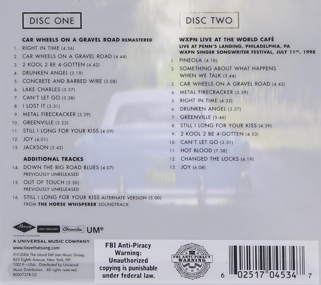 Car Wheels On A Gravel Road Deluxe Edition